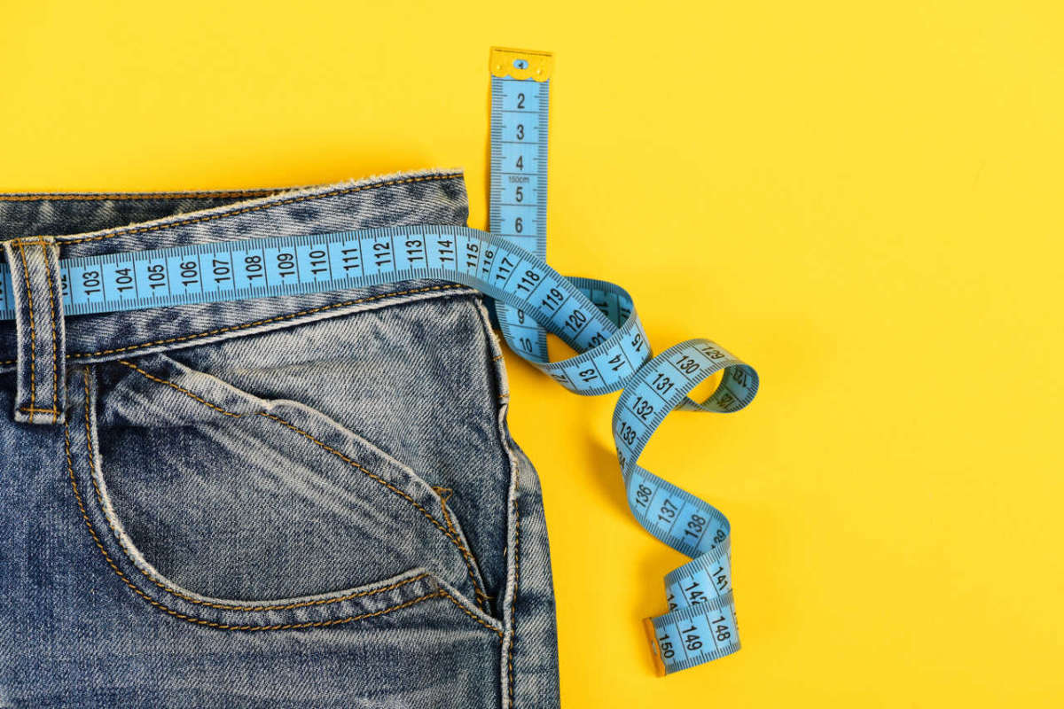 Healthy,lifestyle,and,dieting,concept.,blue,jeans,with,measure,tape