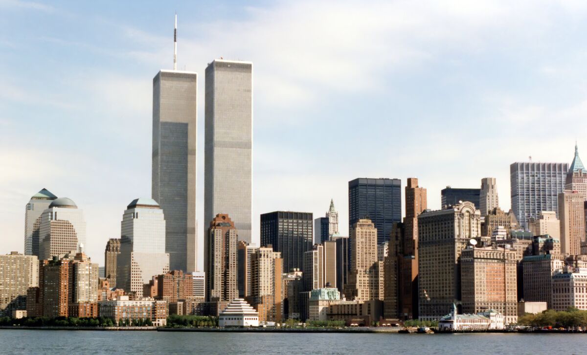 The Lower Manhattan skyline before September 11, 2001, with the World Trade Center’s Twin Towers rising prominently above the waterfront.