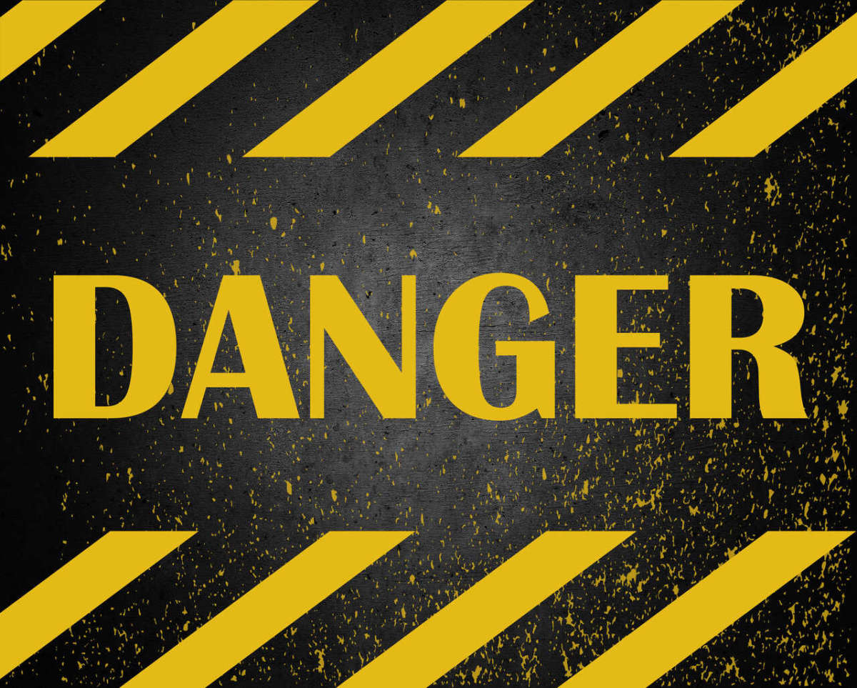 Danger,warning,sign,word,text,painted,over,concrete,wall,background.