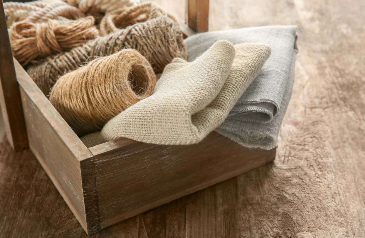Hemp,cloth,and,rope,in,crate,on,wooden,background