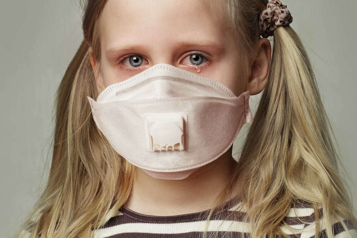 Child,girl,in,protective,medical,mask,crying,,closeup,portrait